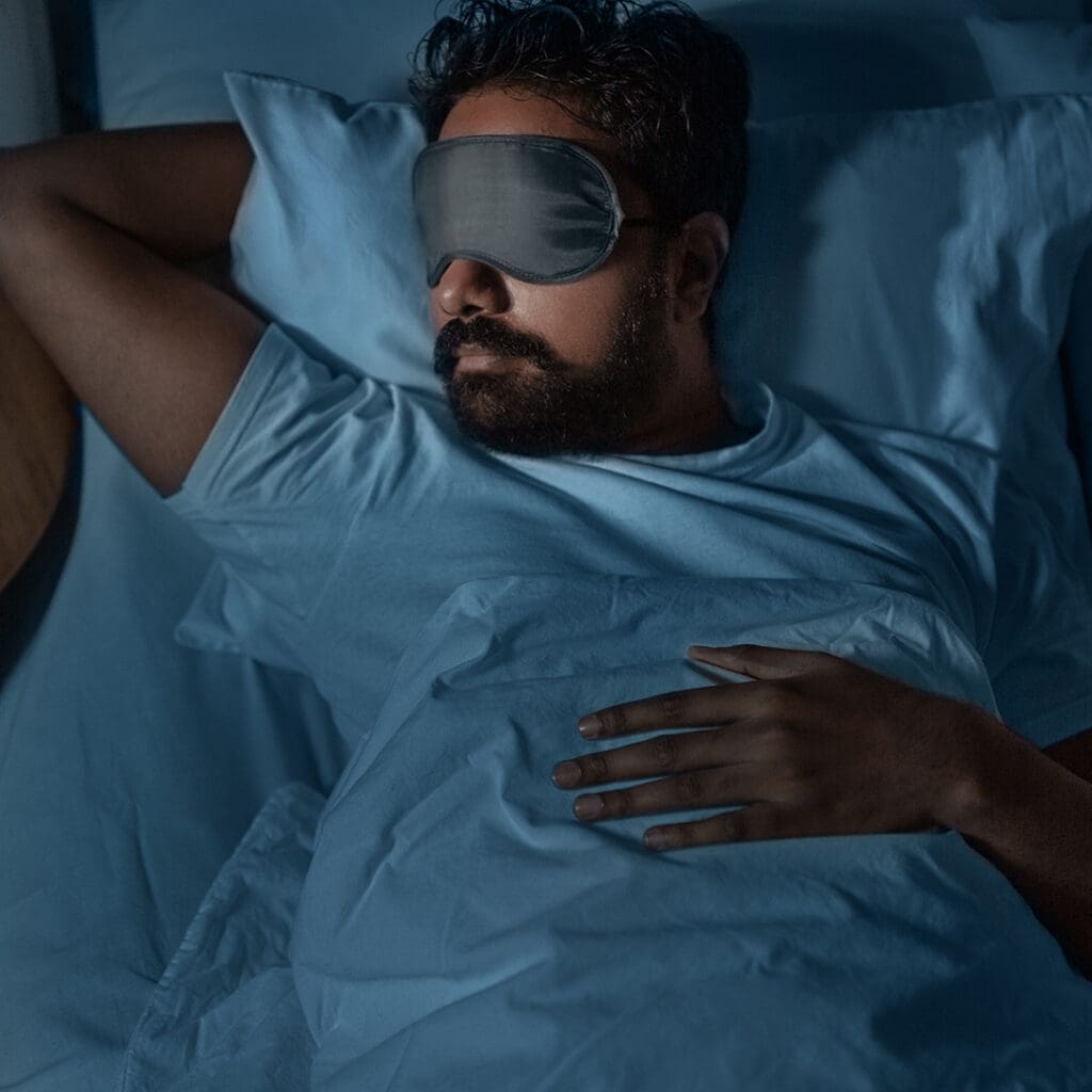 Man sleeping with an eye mask